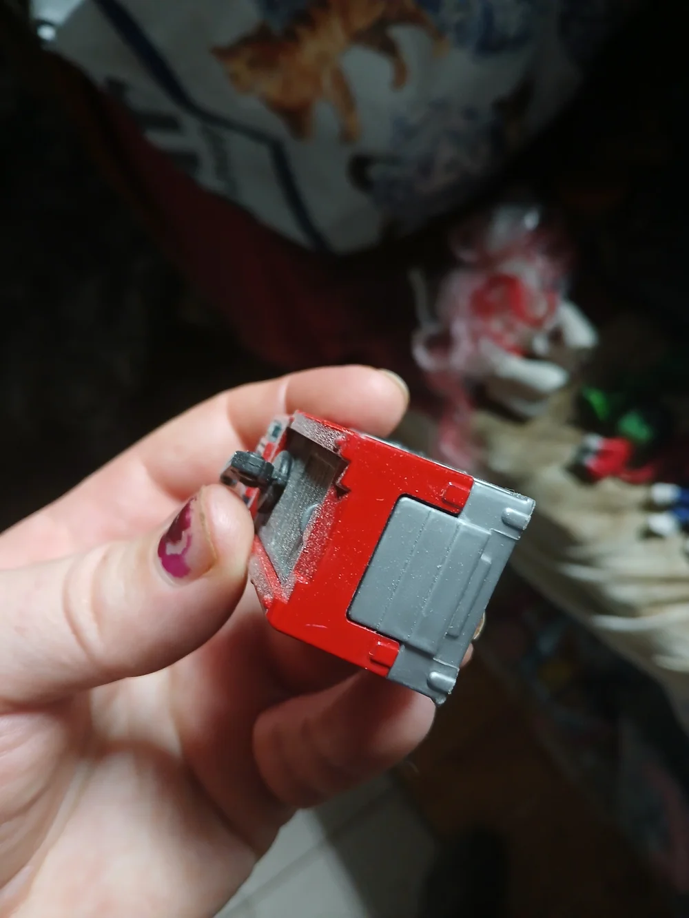 Matchbox Airport Fire Tanker toy vehicle, featuring a red body and a black water